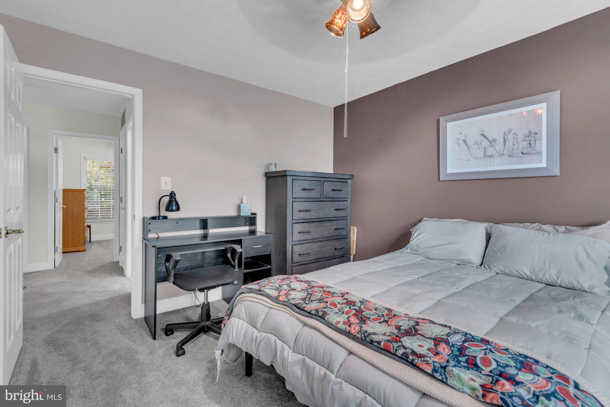 604 Academy Avenue Owings Mills, MD 21117 - Photo 28 of 51 a bedroom with a bed and a chandelier