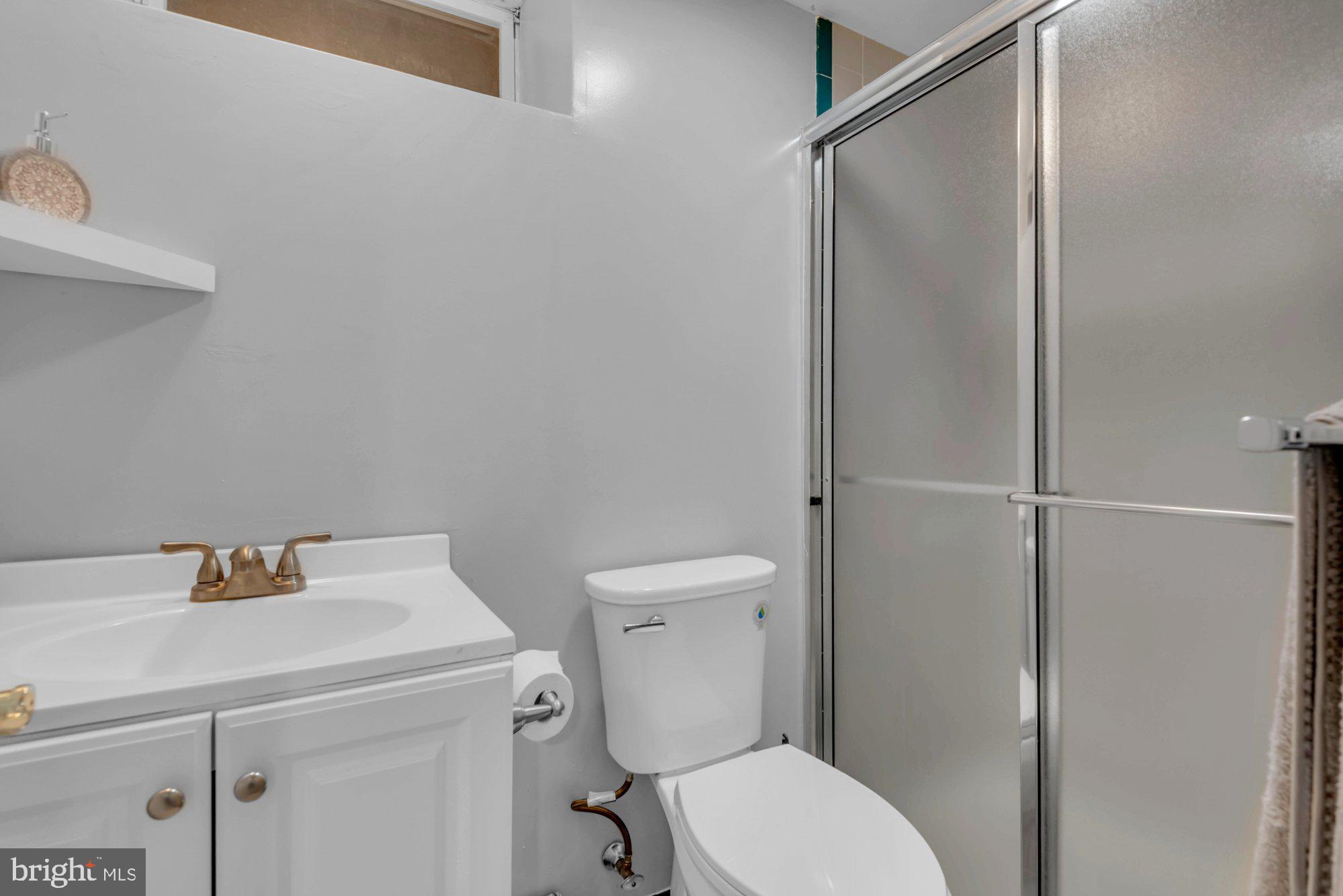 604 Academy Avenue Owings Mills, MD 21117 - Photo 37 of 51 a bathroom with a sink a toilet and shower