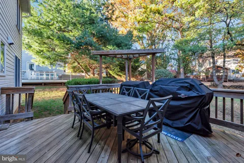 a view of balcony with furniture and wooden deck