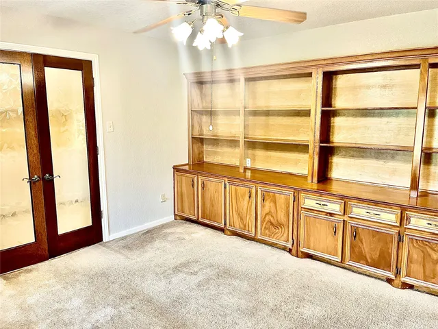 a bathroom with a bathtub and next to a window