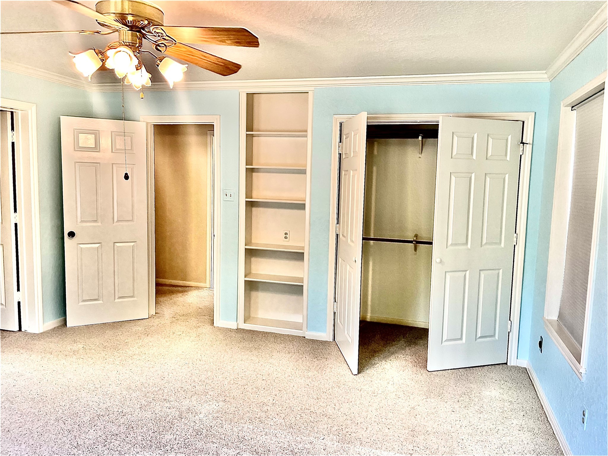 37243 FM 521 Road Bay City, TX 77414 - Photo 14 of 50 an empty room with closet and a ceiling fan
