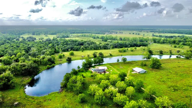 a view of a lake with houses in back