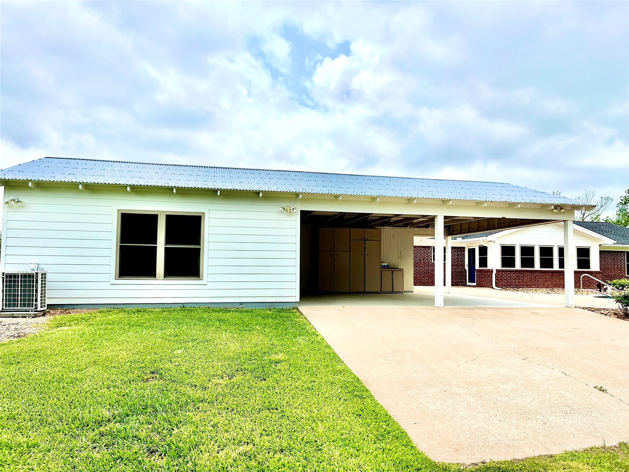 37243 FM 521 Road Bay City, TX 77414 - Photo 28 of 50 a front view of a house with a yard and garage