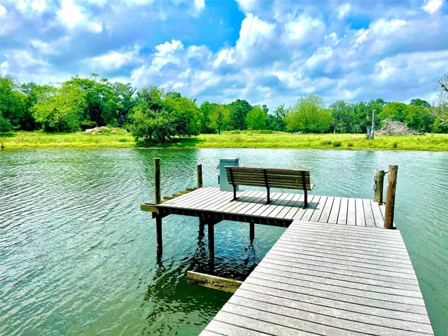 a view of a yard with swimming pool
