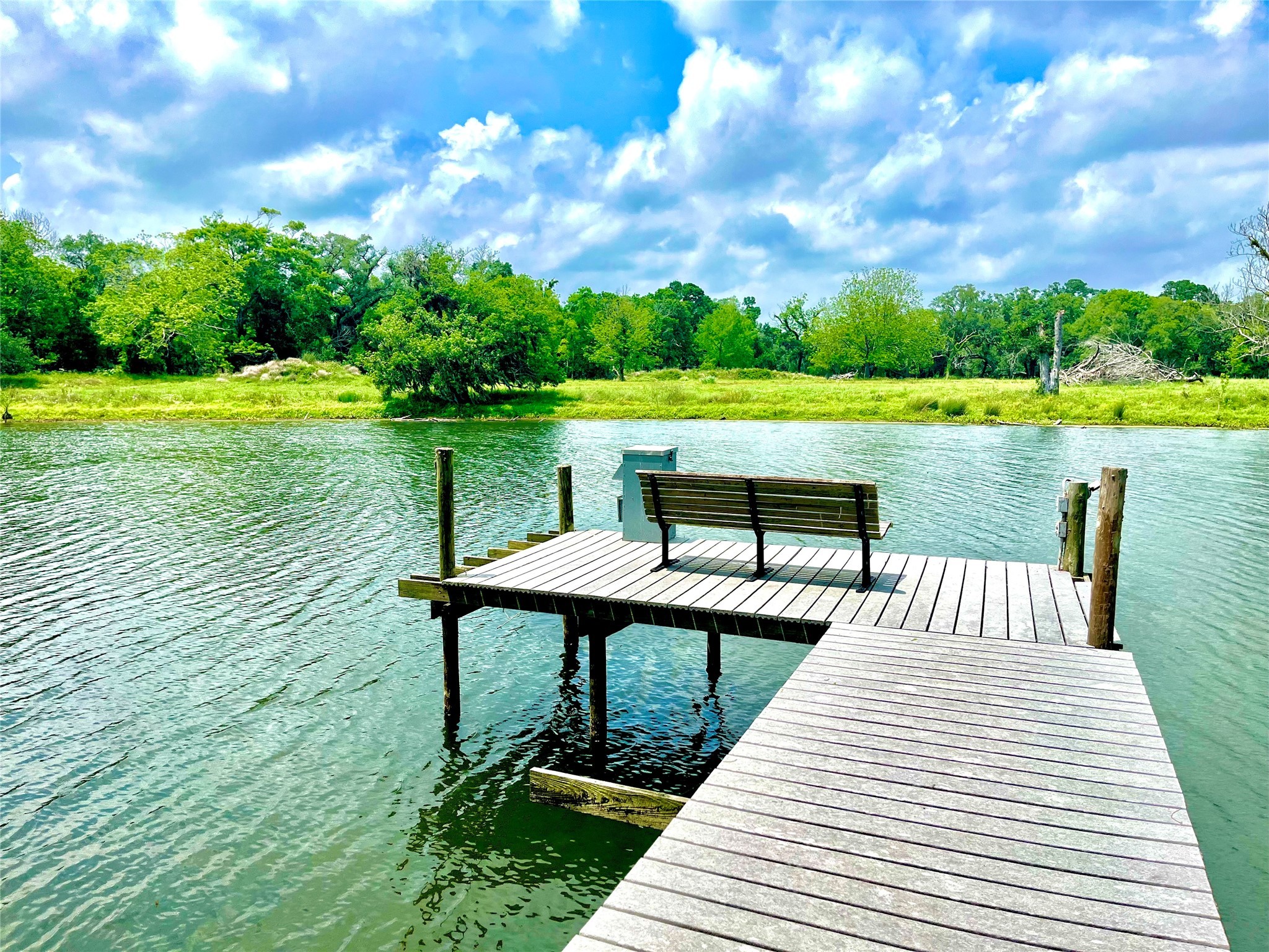 37243 FM 521 Road Bay City, TX 77414 - Photo 40 of 50 a view of a lake with a yard