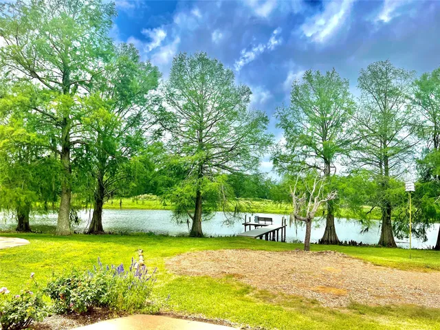 a view of a swimming pool with a yard