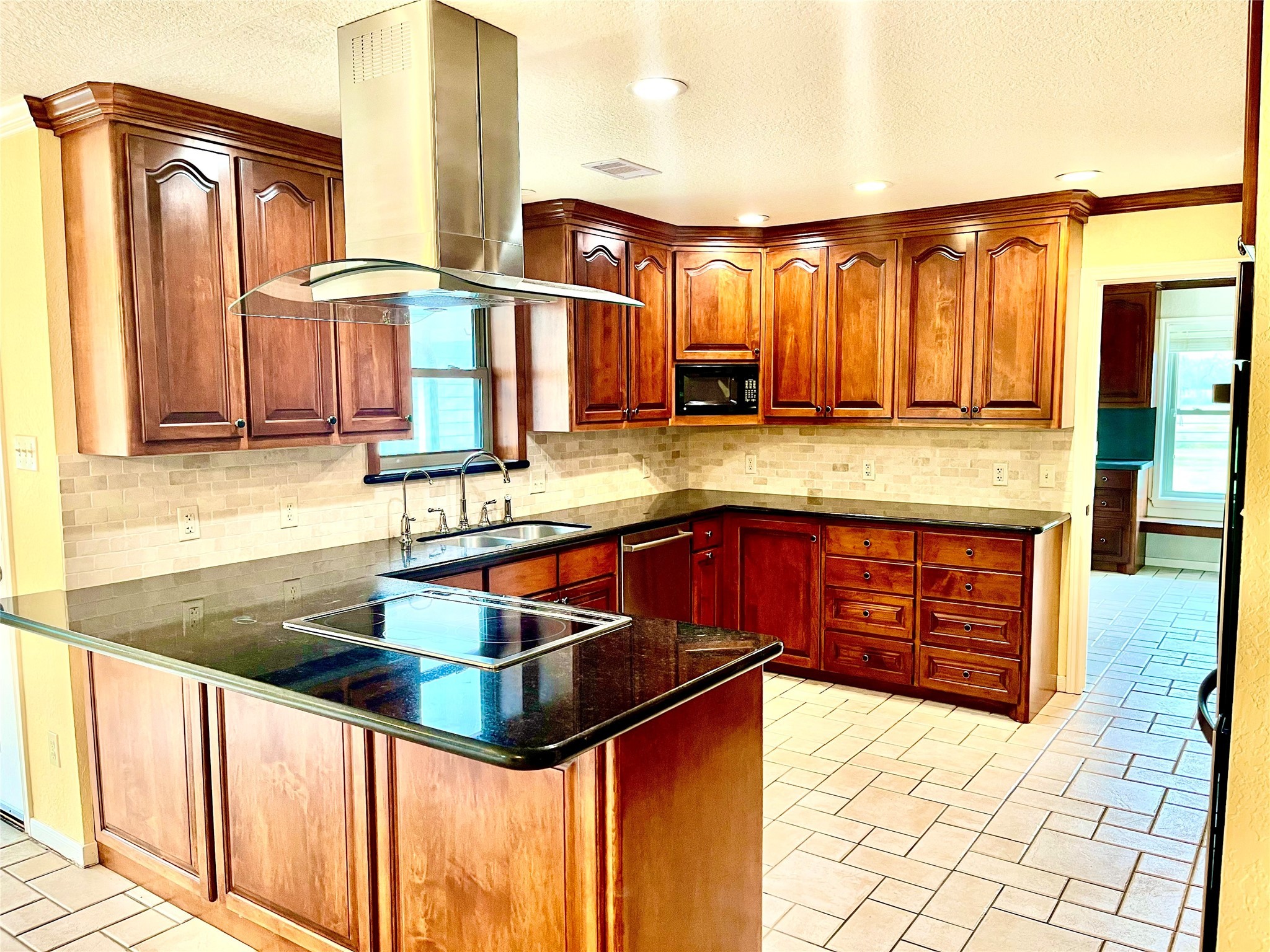 37243 FM 521 Road Bay City, TX 77414 - Photo 6 of 50 a kitchen with stainless steel appliances kitchen island granite countertop a sink and cabinets