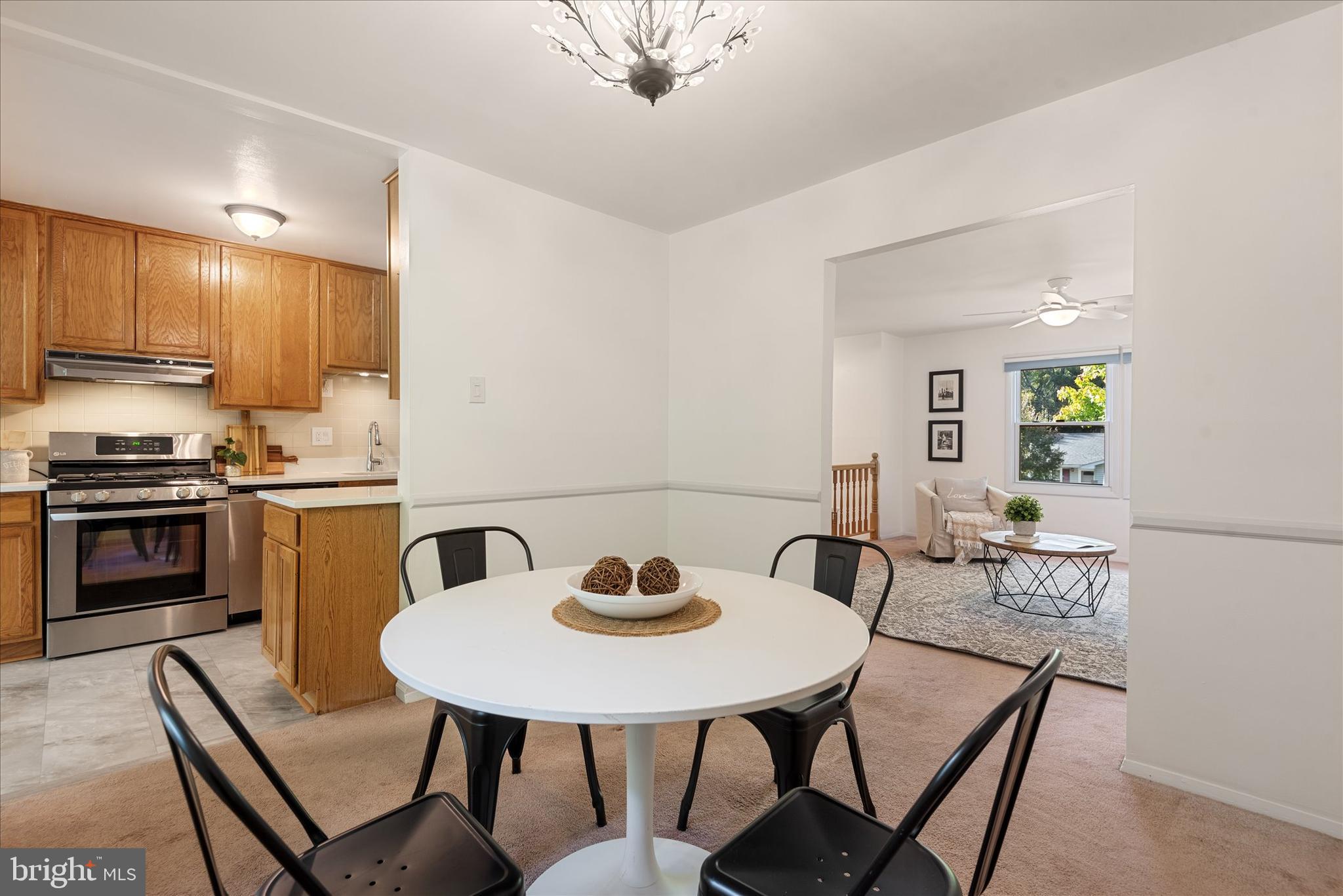 7967 Citadel Drive Severn, MD 21144 - Photo 12 of 52 a view of a dining room with furniture and a kitchen