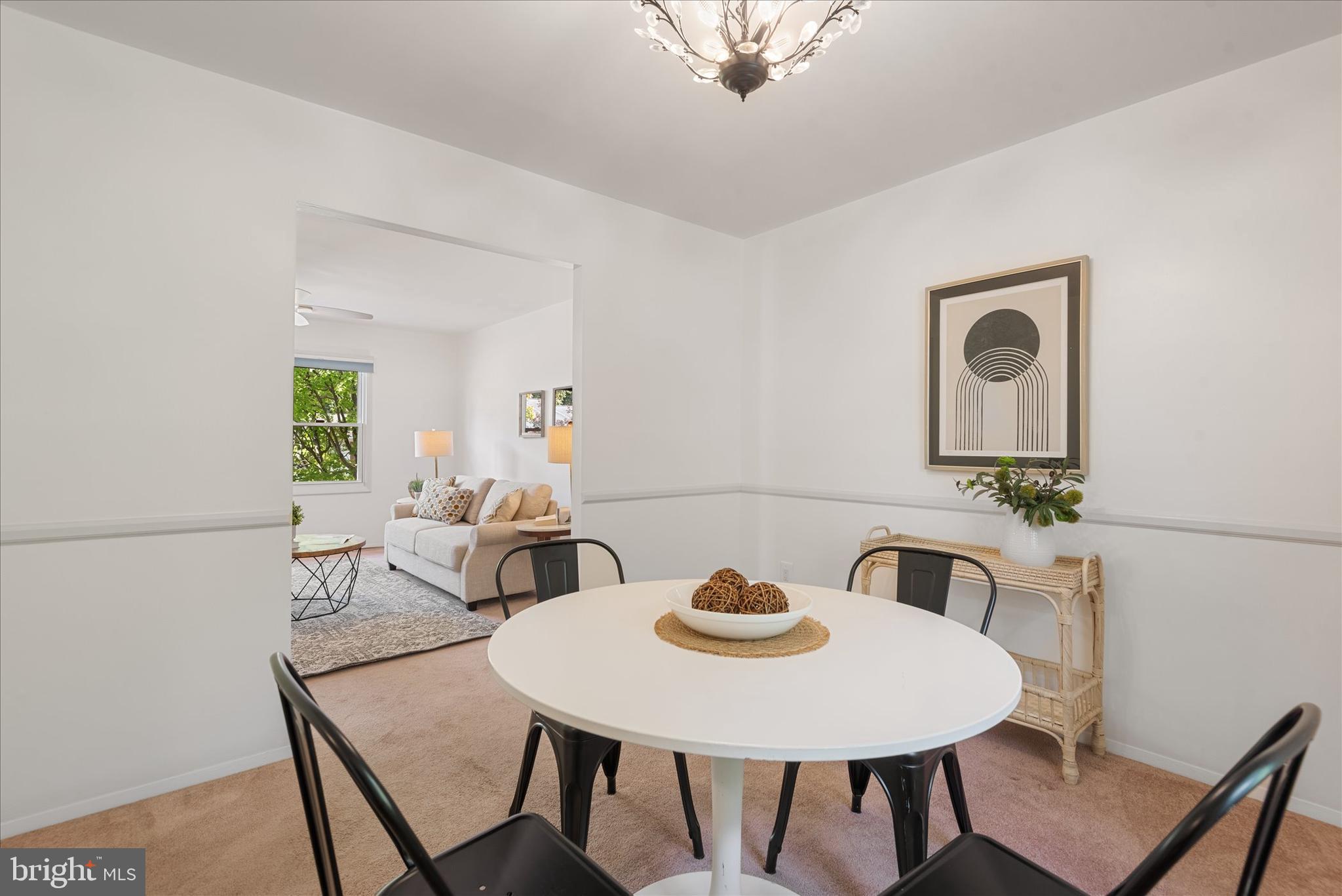7967 Citadel Drive Severn, MD 21144 - Photo 13 of 52 a view of a dining room with furniture and wooden floor