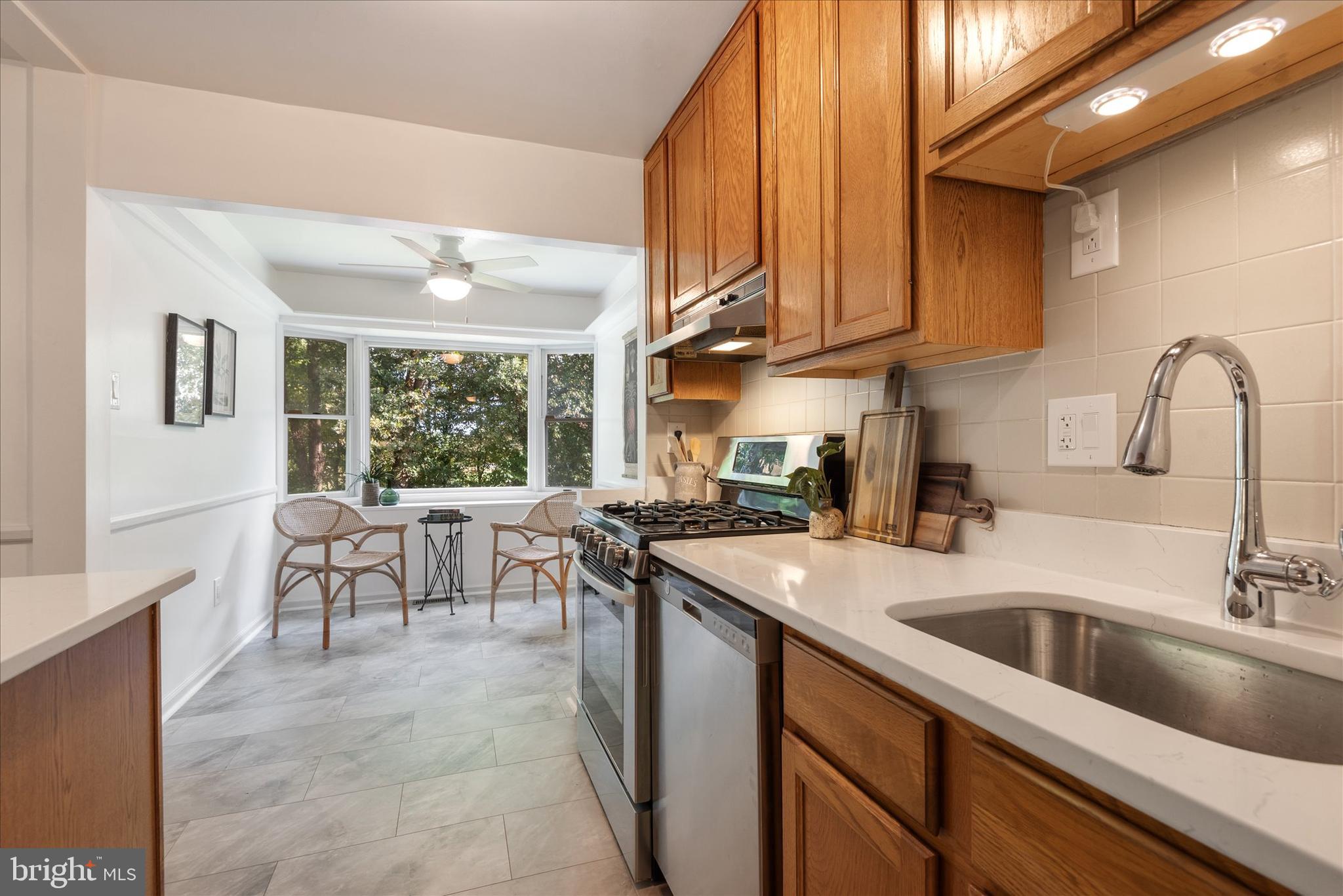 7967 Citadel Drive Severn, MD 21144 - Photo 16 of 52 a kitchen with a sink cabinets and window