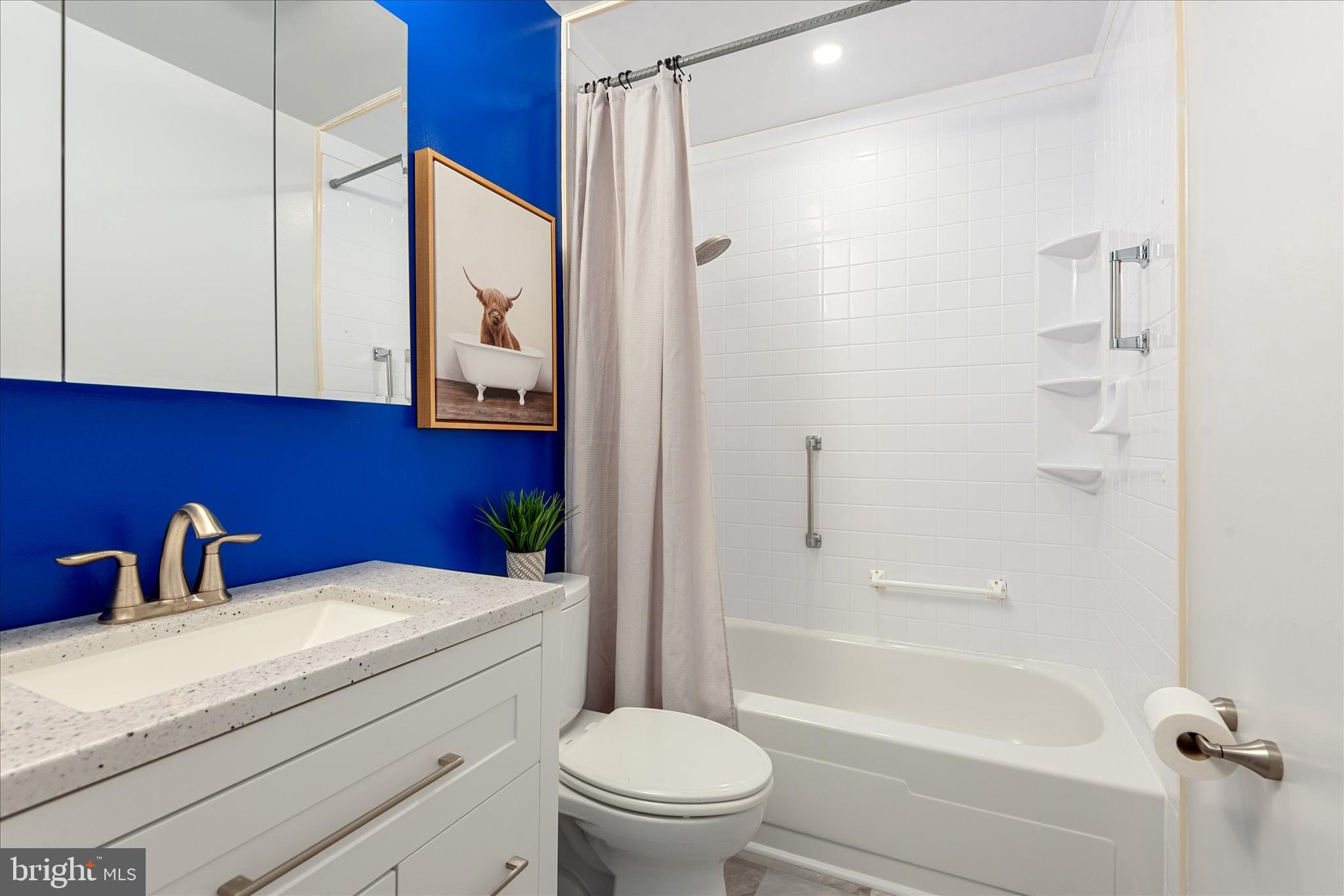 7967 Citadel Drive Severn, MD 21144 - Photo 21 of 52 a bathroom with a toilet a sink and a bathtub