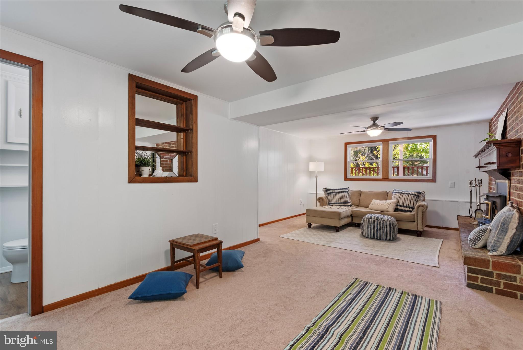 7967 Citadel Drive Severn, MD 21144 - Photo 30 of 52 a living room with furniture and a chandelier