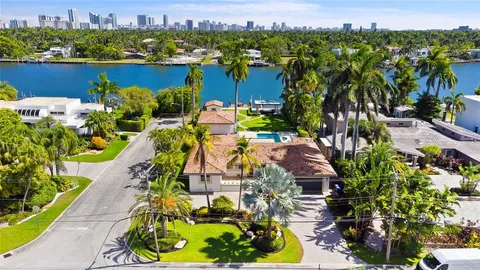 a view of a swimming pool with a lounge chairs