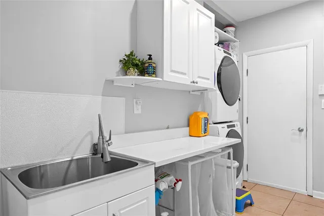 a kitchen with a sink and a stove top oven