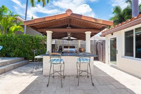 a living room with fireplace furniture and a wooden floor