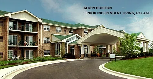a patio with a table and chairs under an umbrella