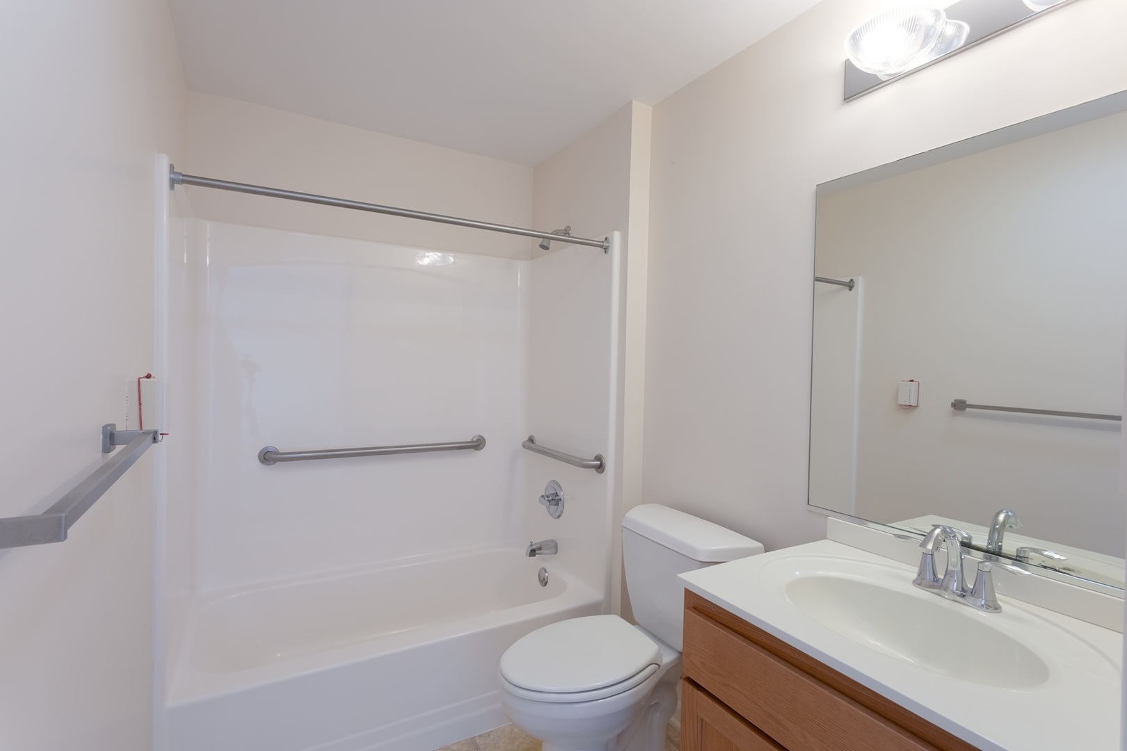 2000 Randi Drive, Unit 310 Aurora, IL 60504 - Photo 15 of 19 a bathroom with a sink a toilet and shower