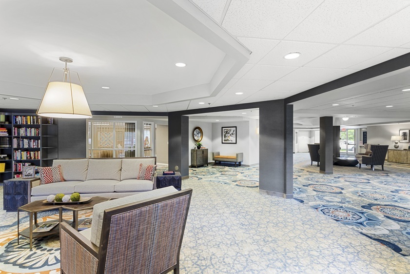 2000 Randi Drive, Unit 310 Aurora, IL 60504 - Photo 6 of 19 a living room with furniture a window and kitchen view