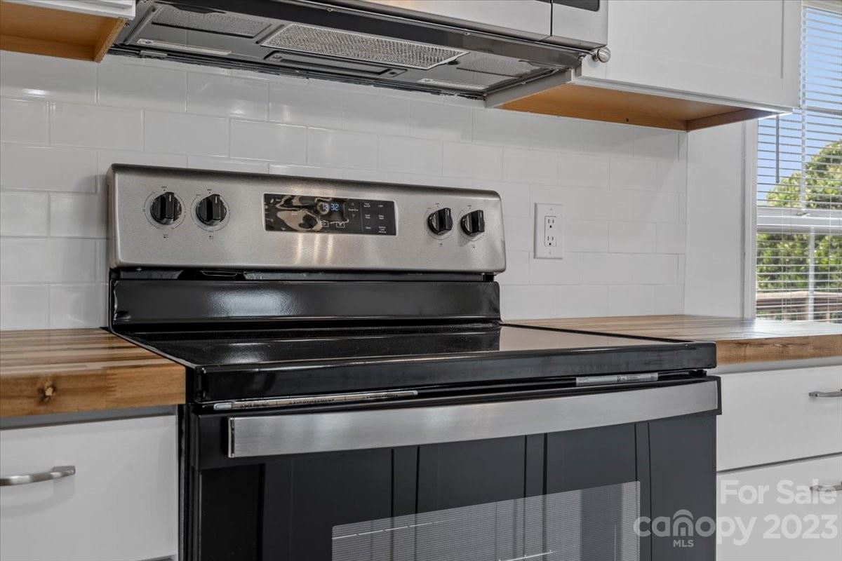 1724 Ruben Road Monroe, NC 28112 - Photo 17 of 28 a stove top oven sitting inside of a kitchen