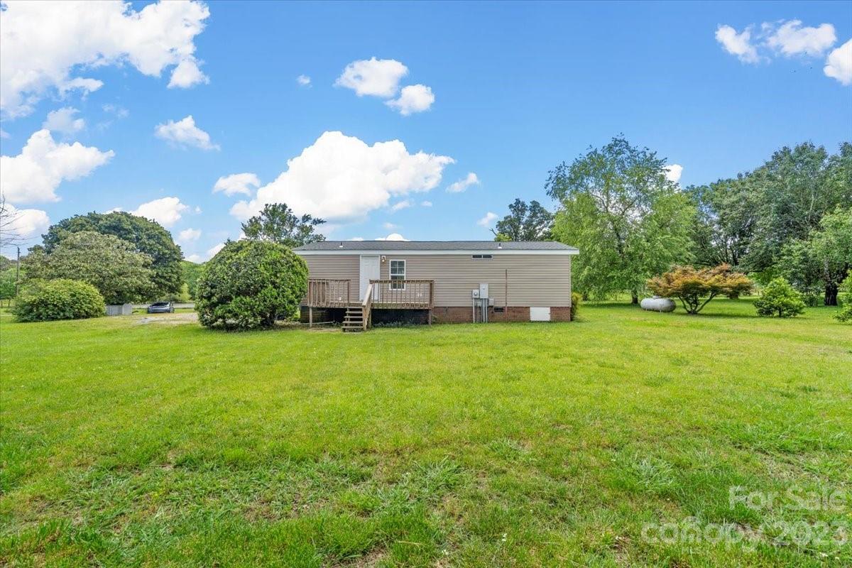 1724 Ruben Road Monroe, NC 28112 - Photo 26 of 28 a view of a house with backyard and garden