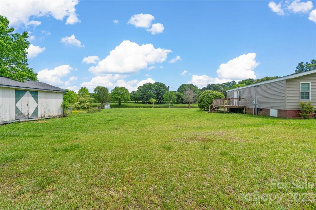 1724 Ruben Road Monroe, NC 28112 - Photo 28 of 28 a view of a house with backyard and garden