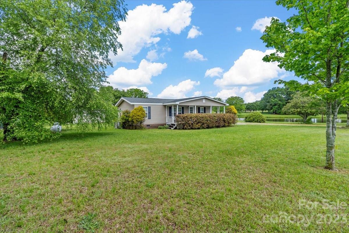 1724 Ruben Road Monroe, NC 28112 - Photo 3 of 28 a front view of a house with garden