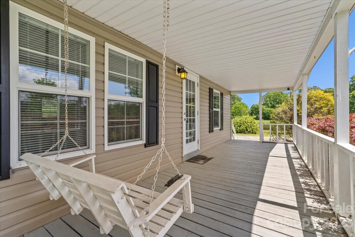 1724 Ruben Road Monroe, NC 28112 - Photo 4 of 28 a balcony with furniture and window