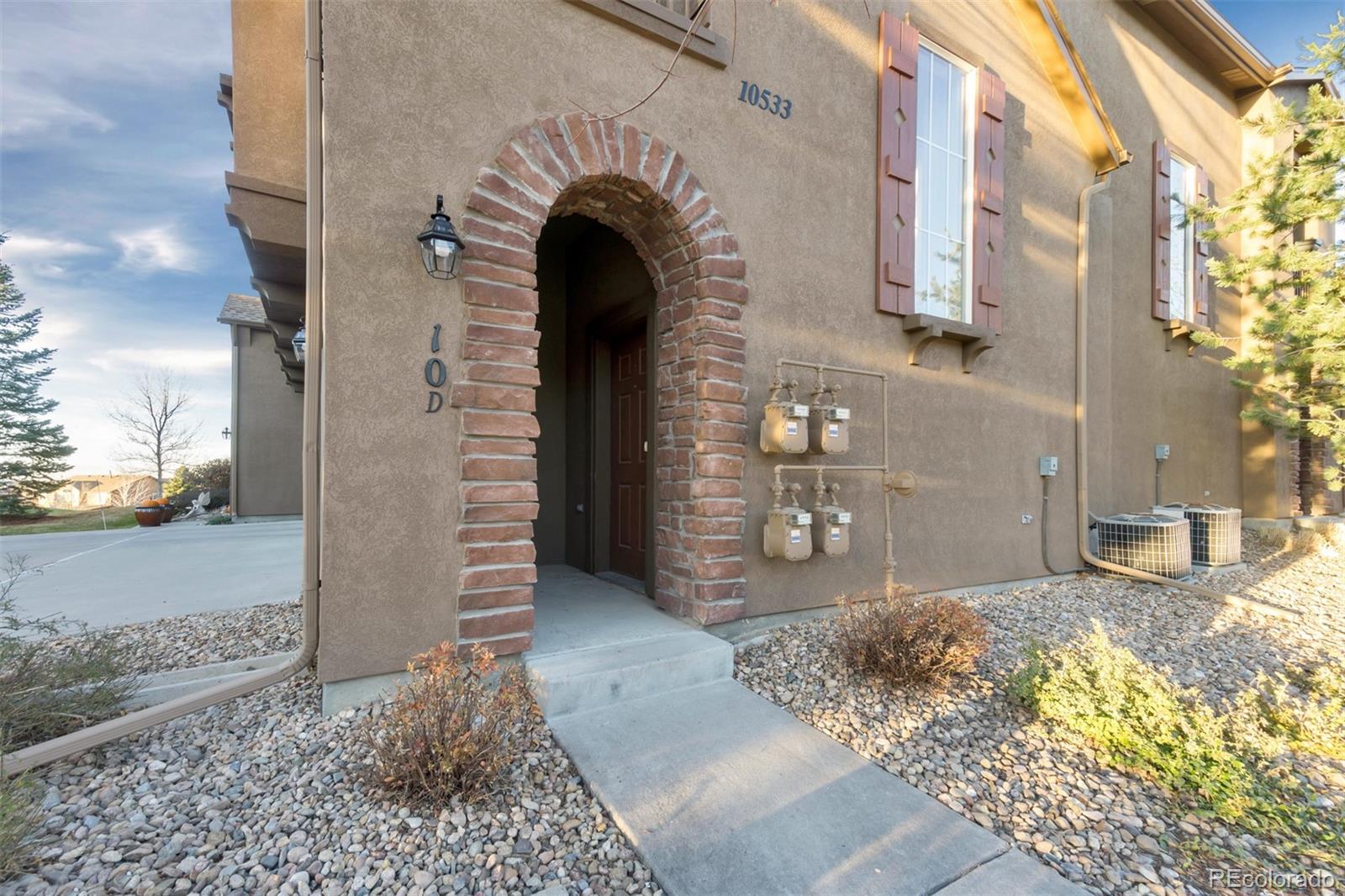 10533 Ashfield Street, Unit D Highlands Ranch, CO 80126 - Photo 1 of 25 a view of an entrance to house