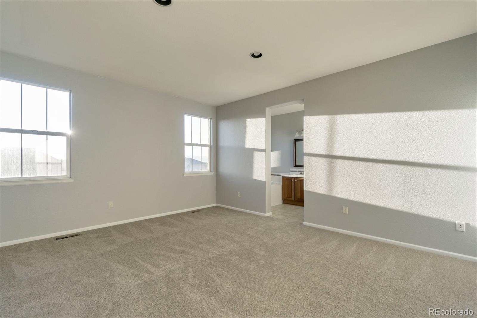 10533 Ashfield Street, Unit D Highlands Ranch, CO 80126 - Photo 11 of 25 a view of a kitchen with a refrigerator and window