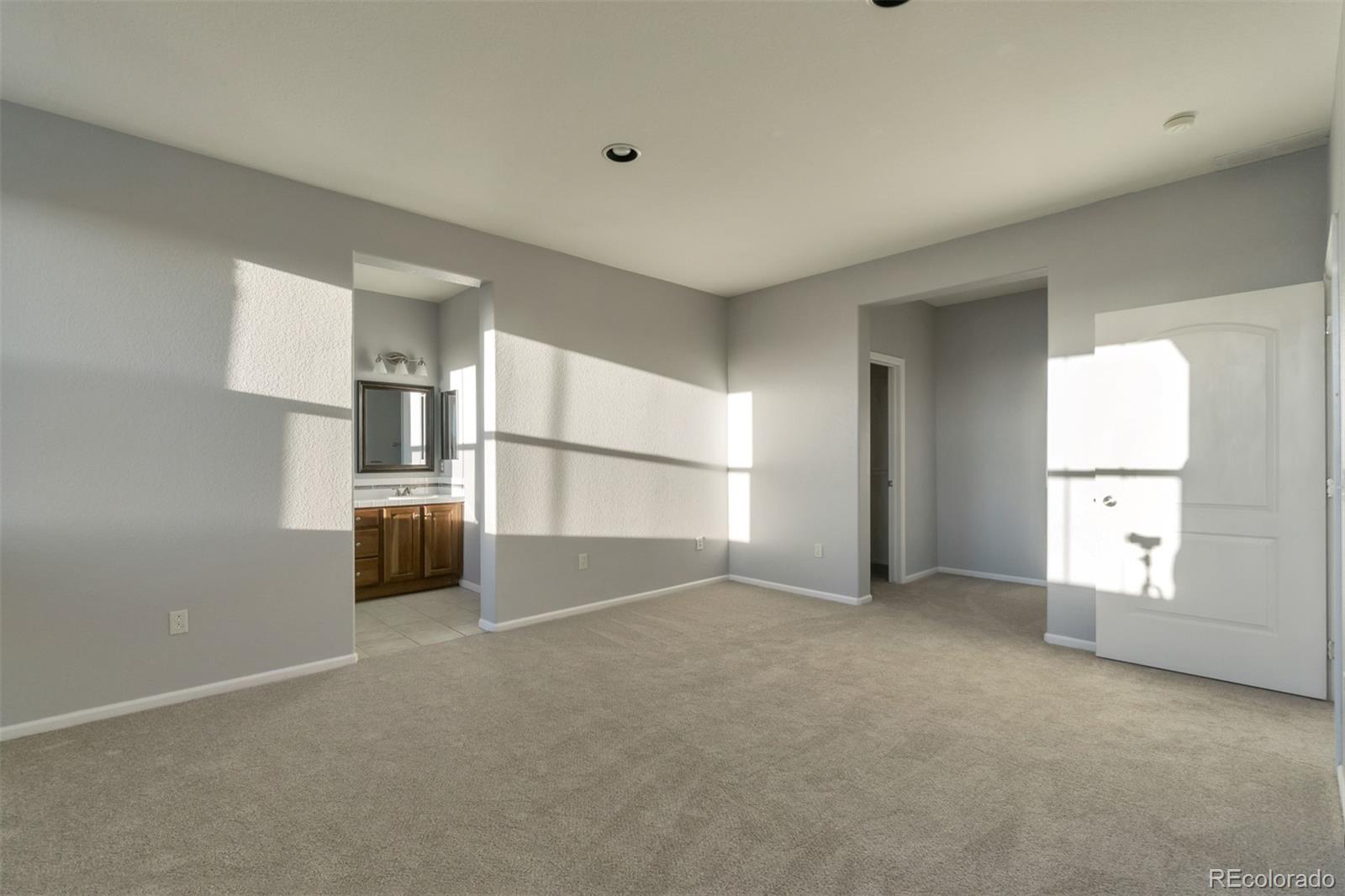 10533 Ashfield Street, Unit D Highlands Ranch, CO 80126 - Photo 12 of 25 a view of empty room with wooden floor