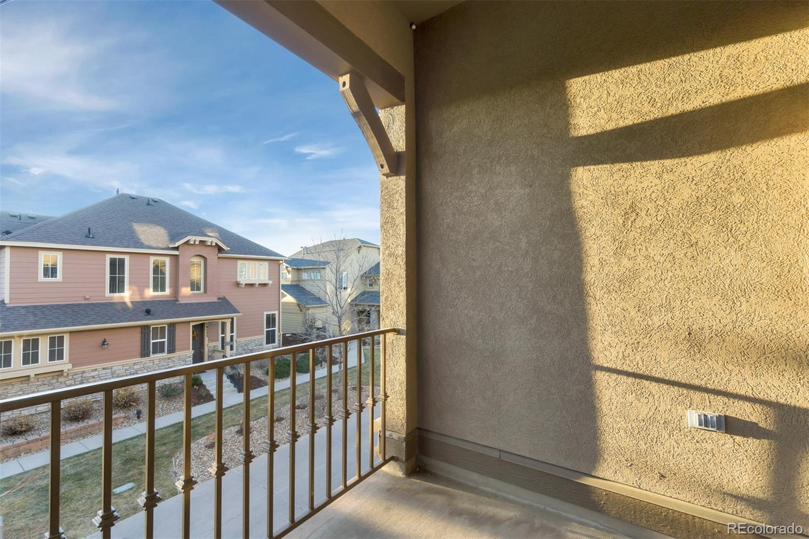 10533 Ashfield Street, Unit D Highlands Ranch, CO 80126 - Photo 17 of 25 a view of a brick house with a large window