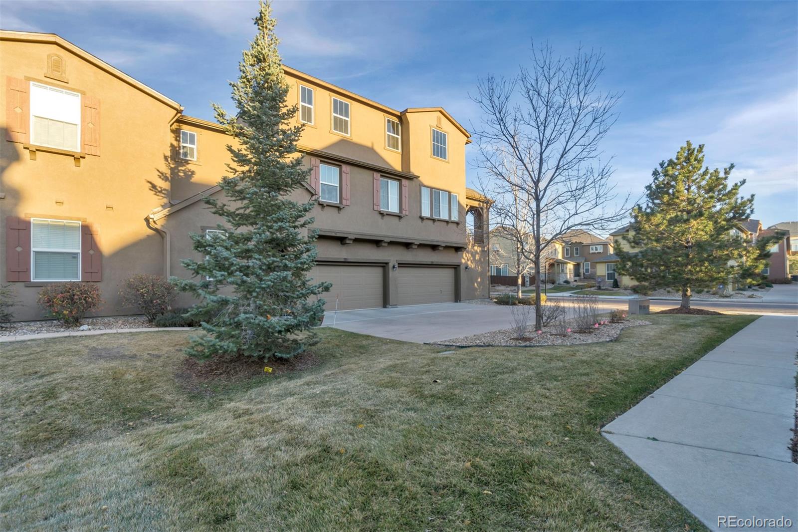 10533 Ashfield Street, Unit D Highlands Ranch, CO 80126 - Photo 24 of 25 a front view of a house with garden