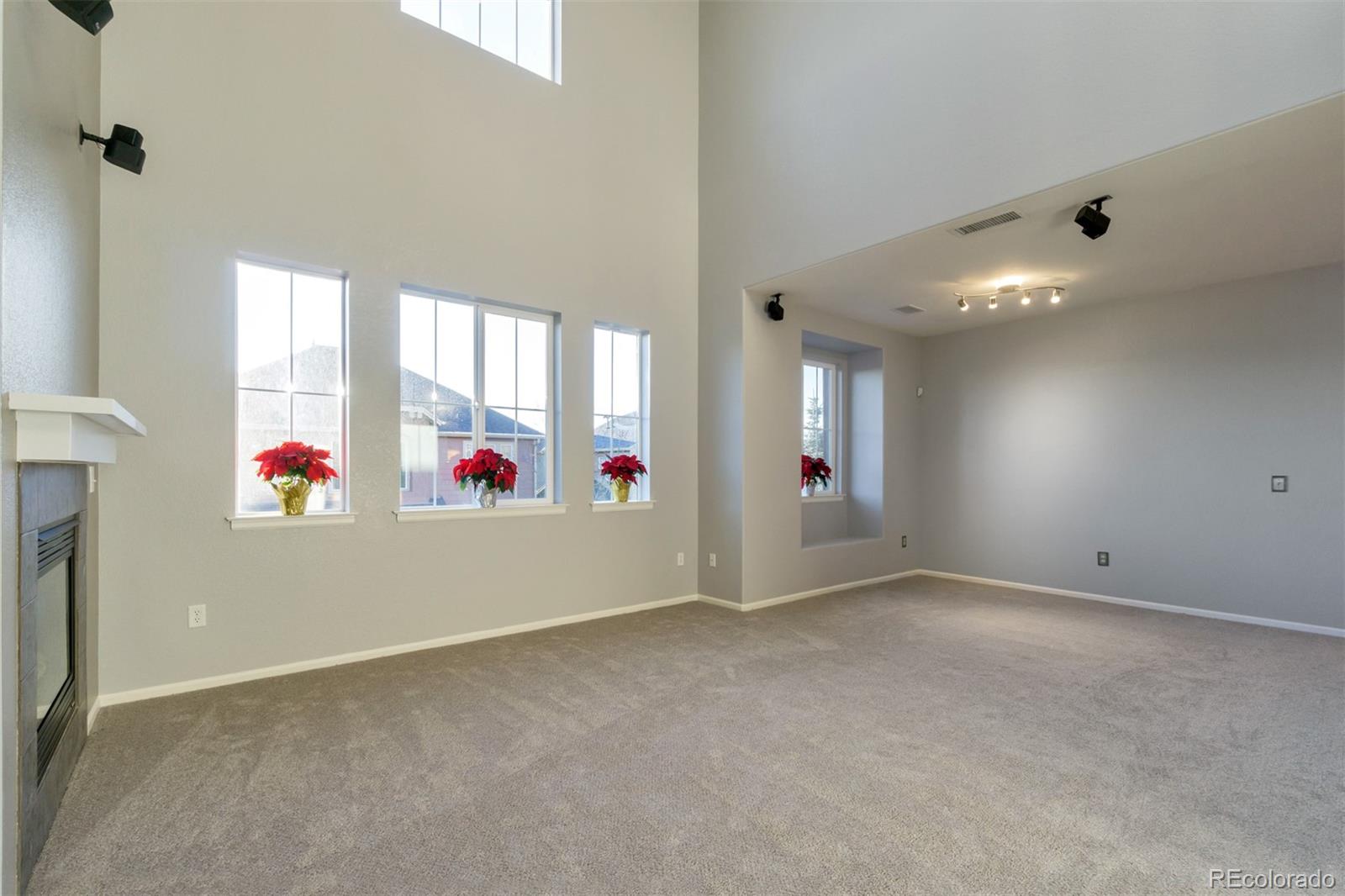 10533 Ashfield Street, Unit D Highlands Ranch, CO 80126 - Photo 6 of 25 an empty room with an entryway and window