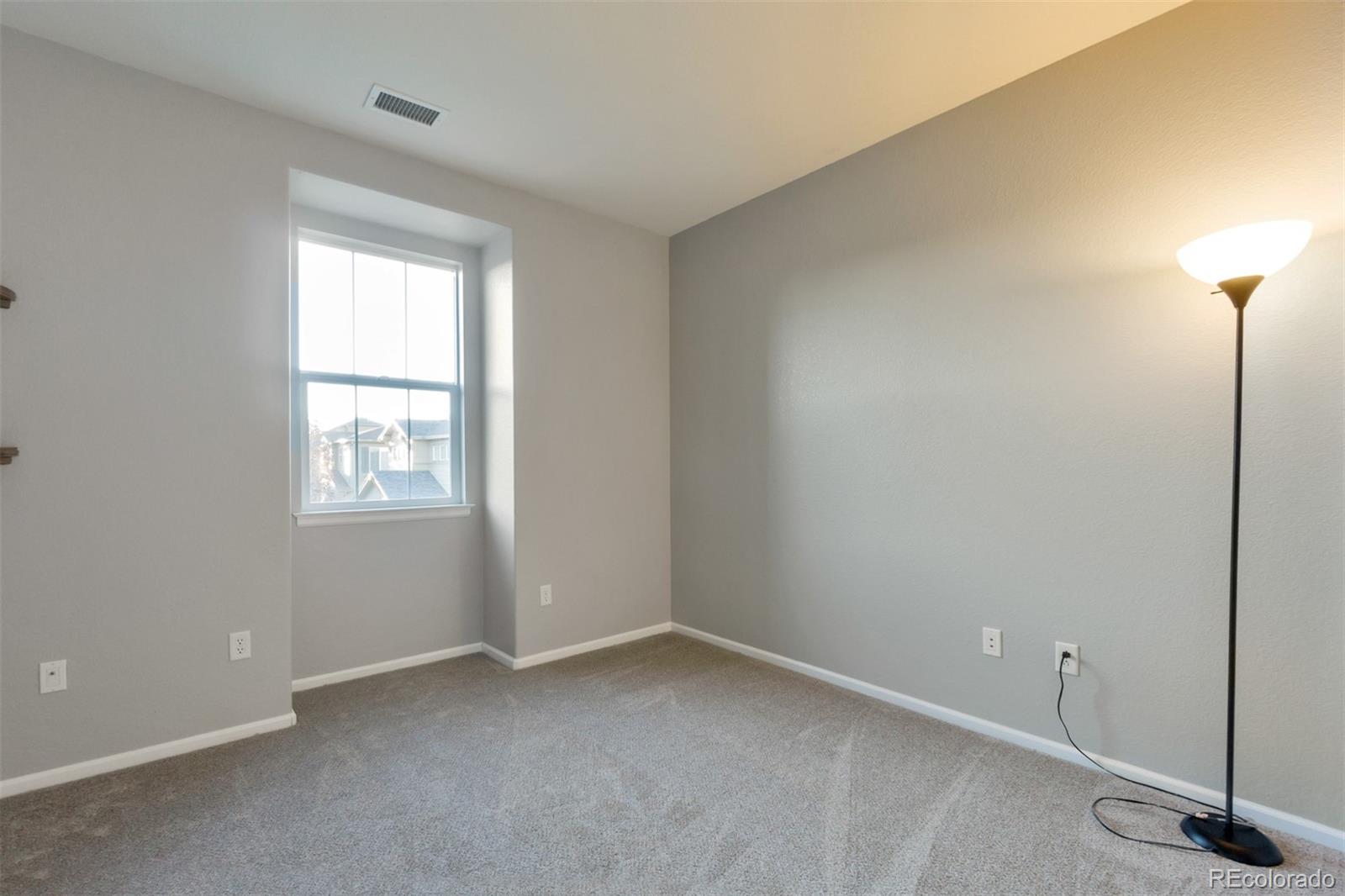 10533 Ashfield Street, Unit D Highlands Ranch, CO 80126 - Photo 8 of 25 an empty room with windows