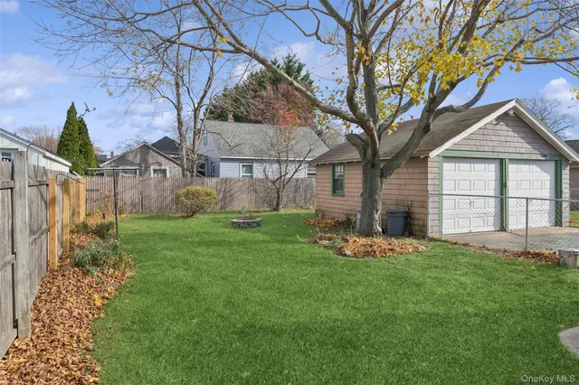 a front view of a house with a garden and yard