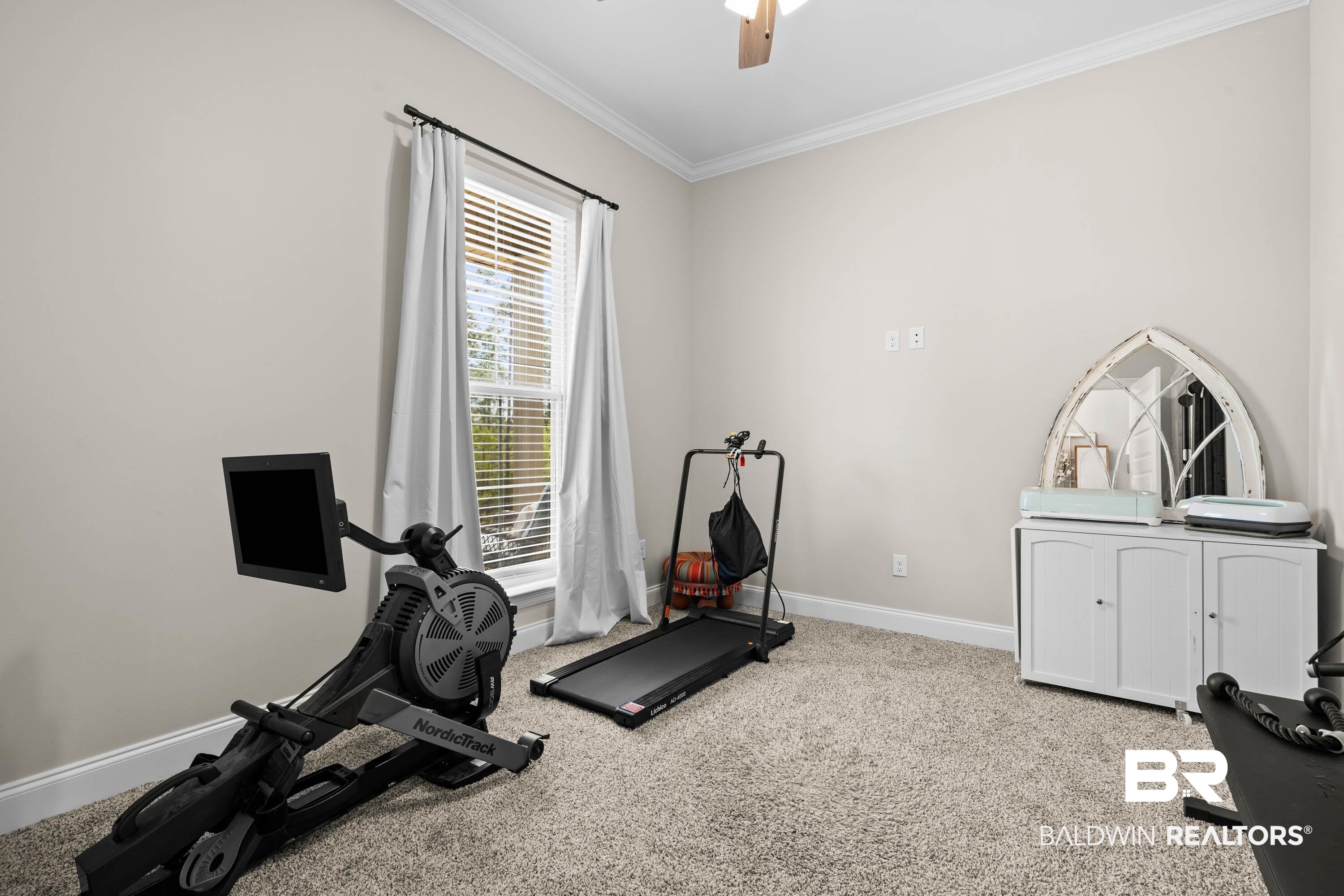 7150 Powell Road, Unit LOT 6A Eight Mile, AL 36613 - Photo 19 of 35 Workout room with light carpet, crown molding, and a ceiling fan
