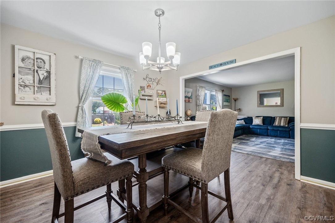 366 Brout Drive Hampton, VA 23666 - Photo 13 of 32 a view of a dining room with furniture a chandelier and wooden floor