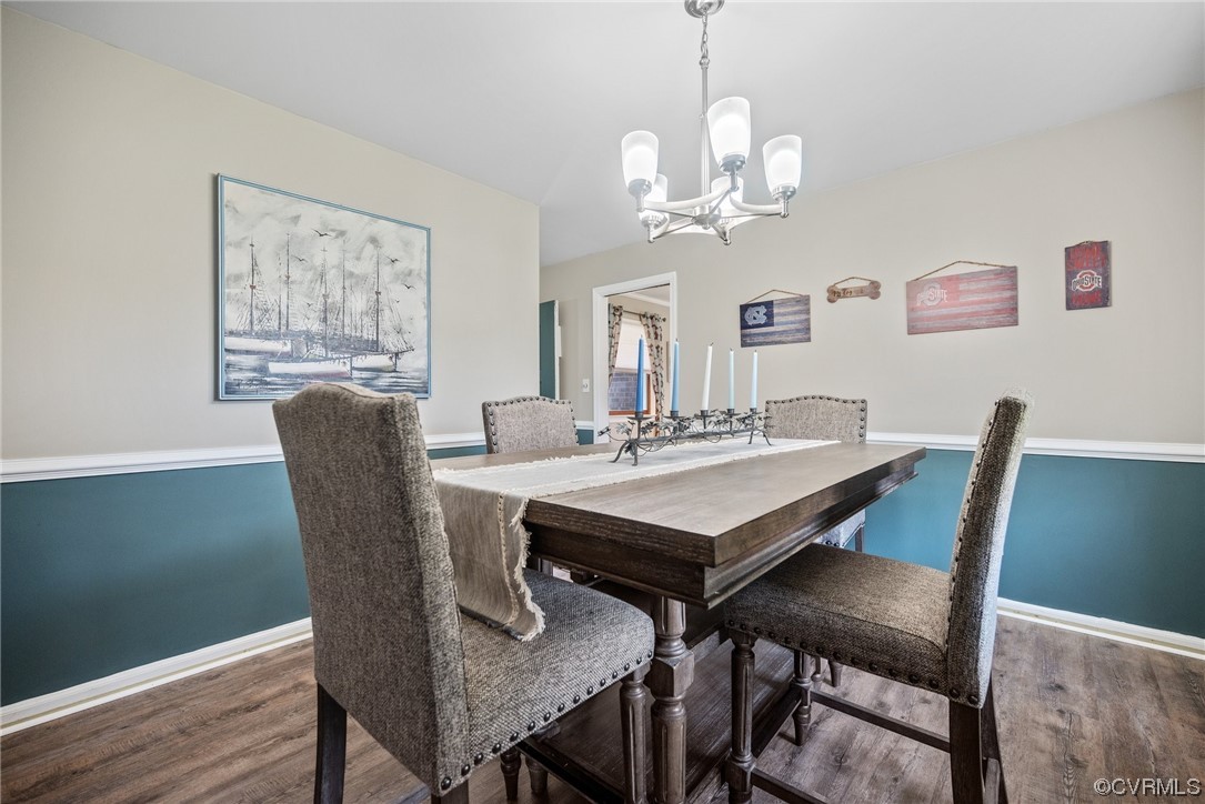 366 Brout Drive Hampton, VA 23666 - Photo 14 of 32 a view of a dining room with furniture a chandelier and wooden floor