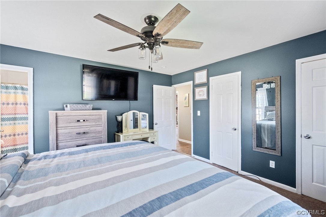366 Brout Drive Hampton, VA 23666 - Photo 25 of 32 a bedroom with a bed a flat screen tv and a dresser