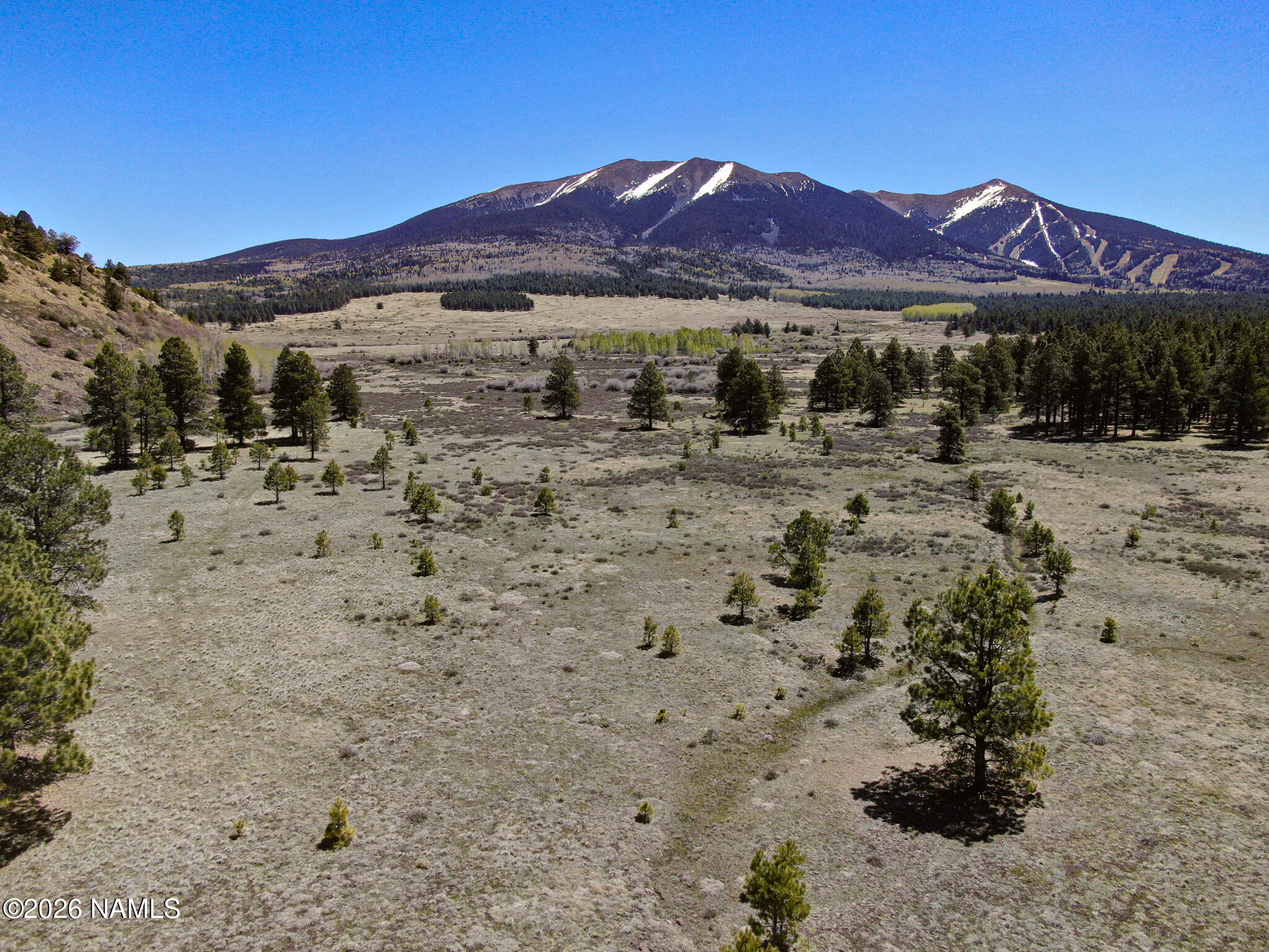 1 Hart Prairie Road Flagstaff, AZ 86001 - Photo 1 of 25 a view of a lake with a mountain in the background