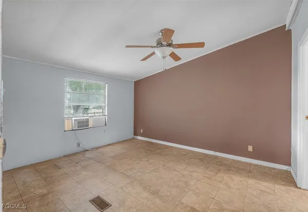 a view of an empty room with a window