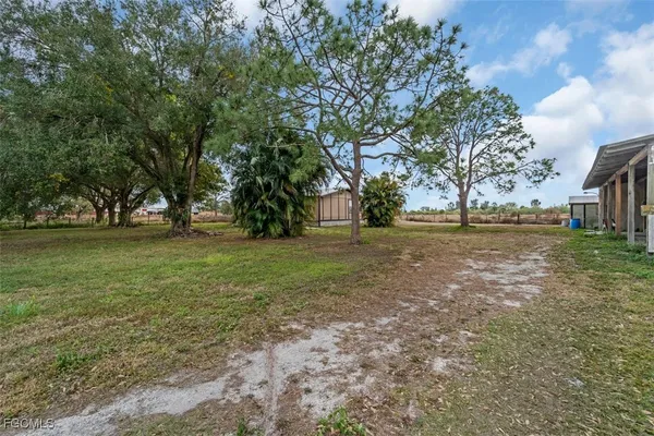 a view of outdoor space with deck and yard