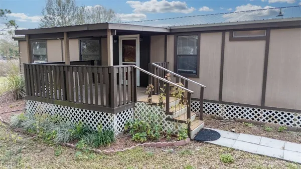 a view of a deck with a yard