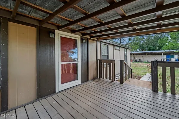 a view of a balcony with wooden floor