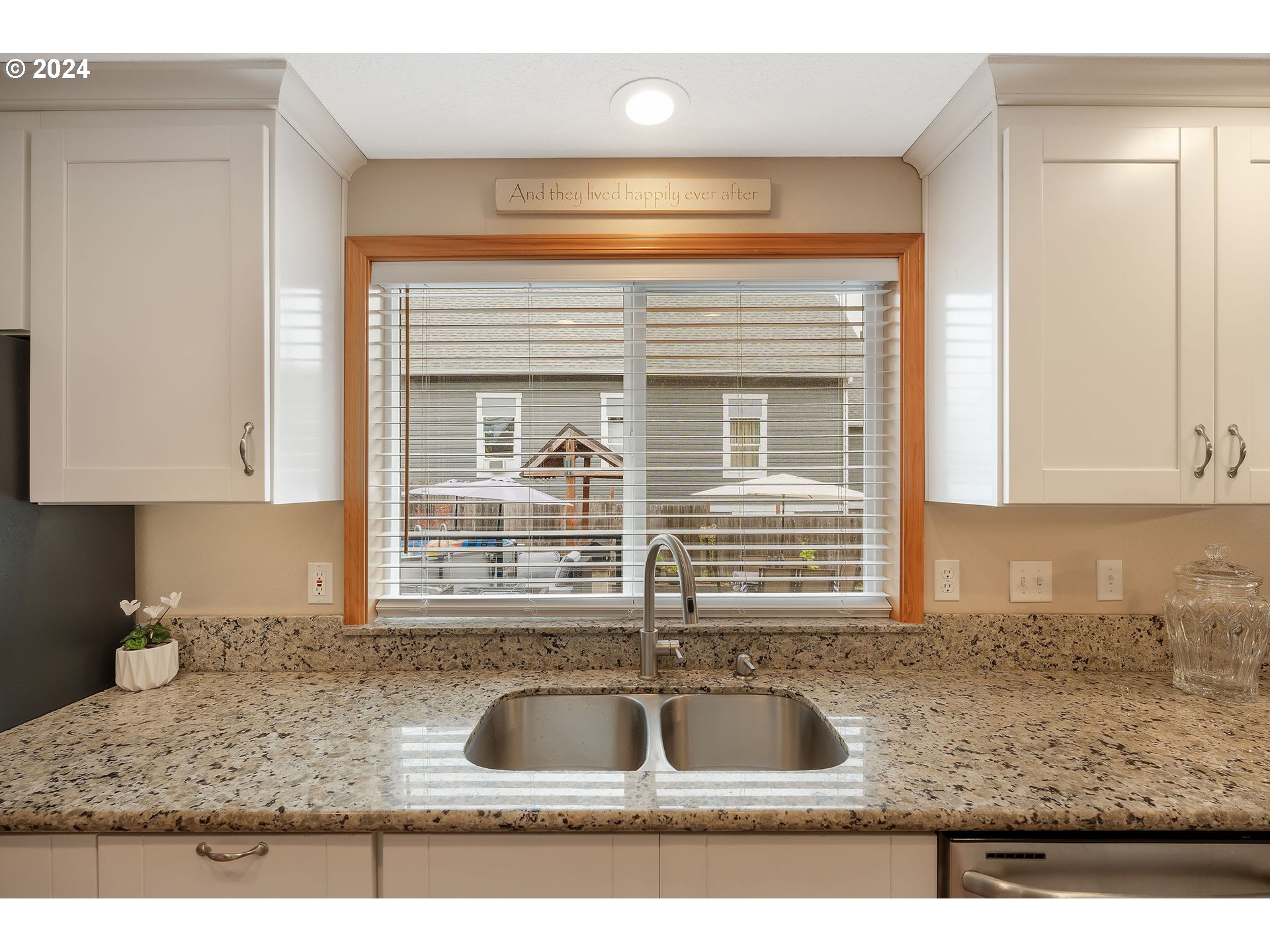 103 Park Street Gaston, OR 97119 - Photo 13 of 47 a kitchen with granite countertop a sink and a window