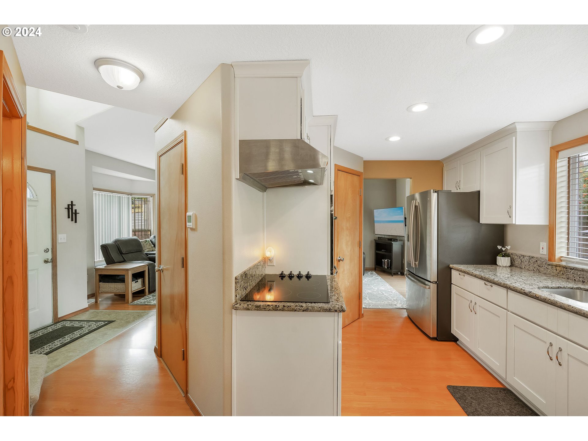 103 Park Street Gaston, OR 97119 - Photo 16 of 47 a kitchen with stainless steel appliances kitchen island granite countertop a refrigerator and a sink