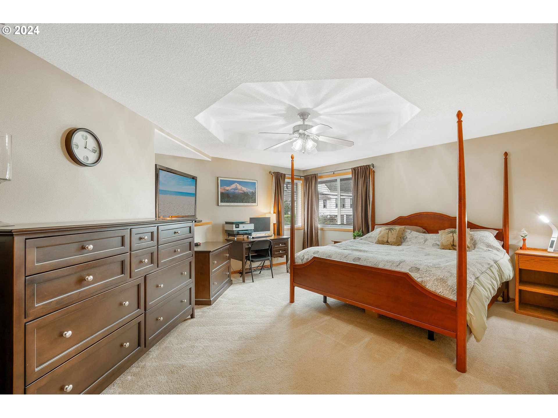 103 Park Street Gaston, OR 97119 - Photo 19 of 47 a bedroom with a large bed and a chandelier