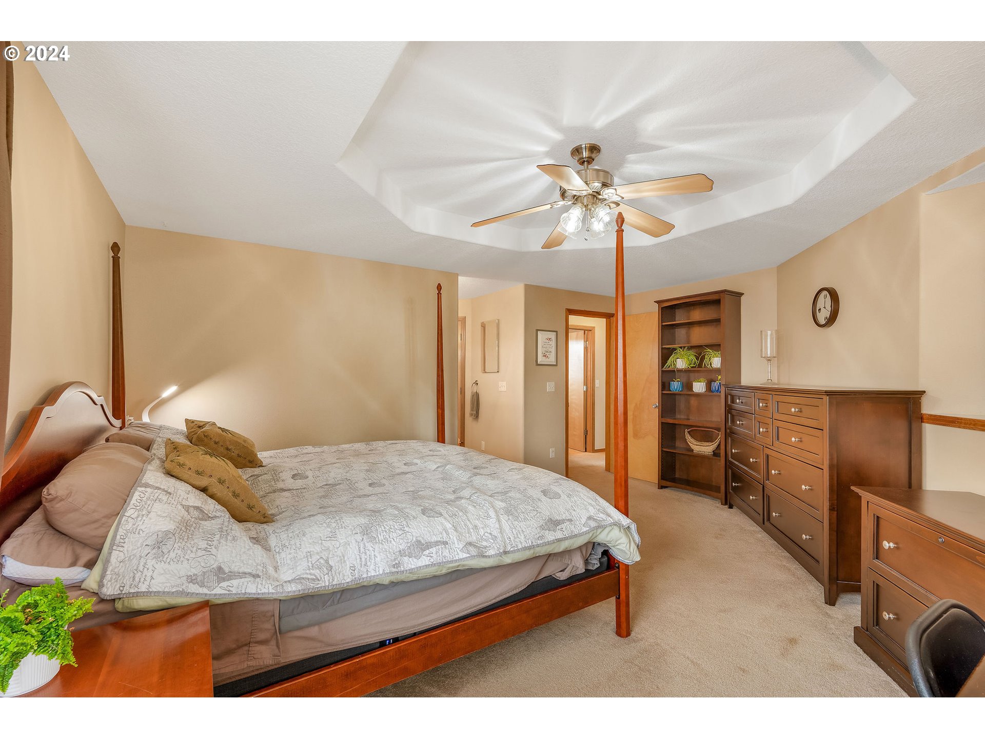 103 Park Street Gaston, OR 97119 - Photo 21 of 47 a bedroom with a bed and a chandelier