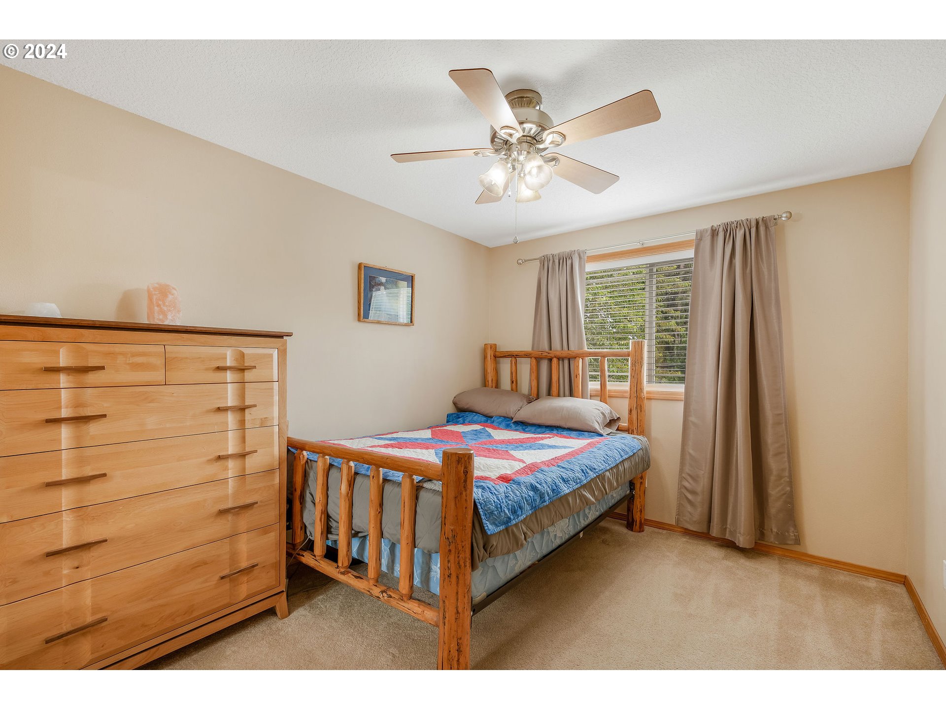 103 Park Street Gaston, OR 97119 - Photo 26 of 47 a bedroom with a bed and wooden floor
