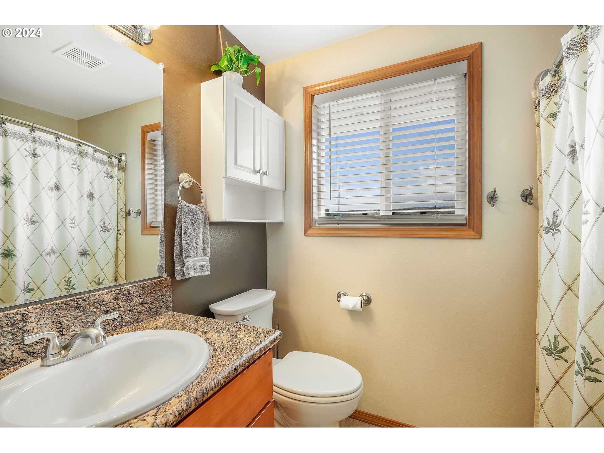103 Park Street Gaston, OR 97119 - Photo 28 of 47 a bathroom with a granite countertop sink toilet and mirror